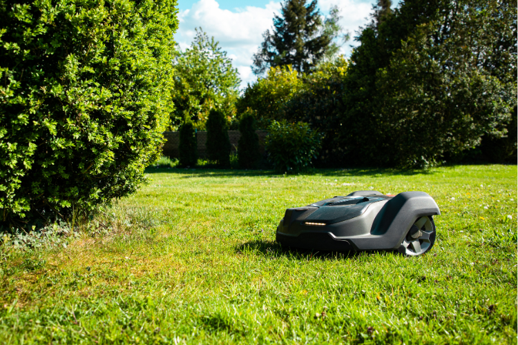 A sleek gray lawn mower robot