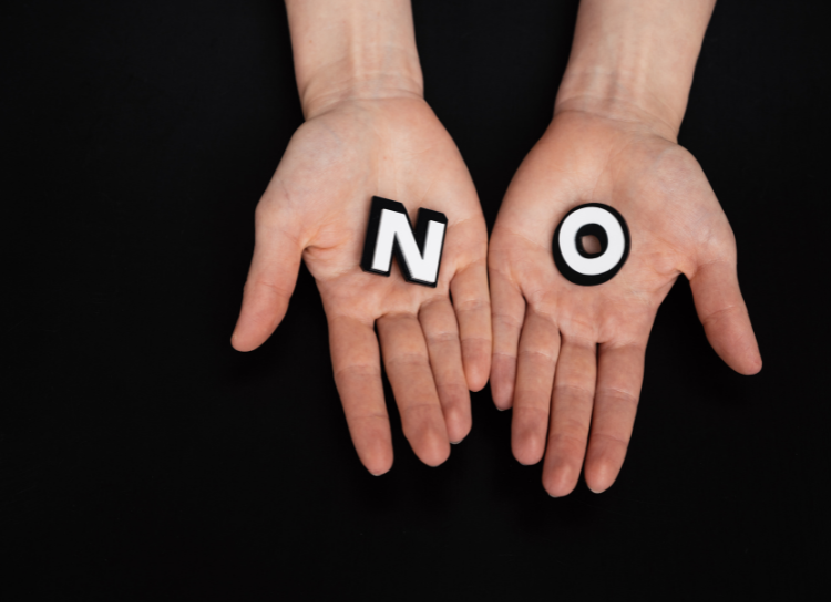 A pair of hands showing the letters N and O