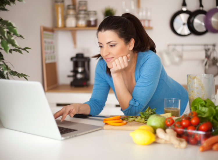 A woman using her computer for nutrition planning